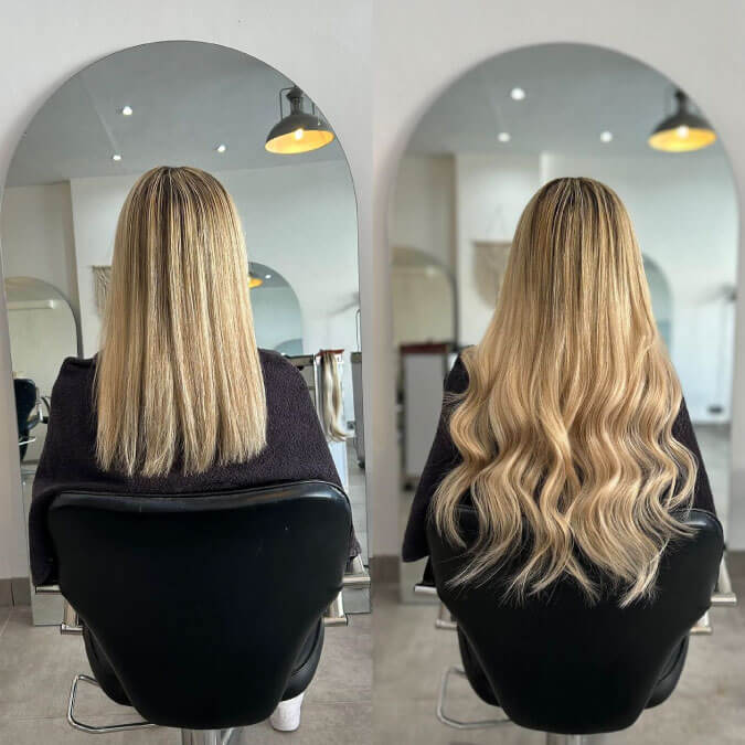 A side-by-side comparison showing the back view of a woman's head before and after hair extensions. The left image shows the woman with straight, shoulder-length blonde hair. The right image shows the same woman with long, wavy blonde hair reaching down her back, illustrating the significant transformation.